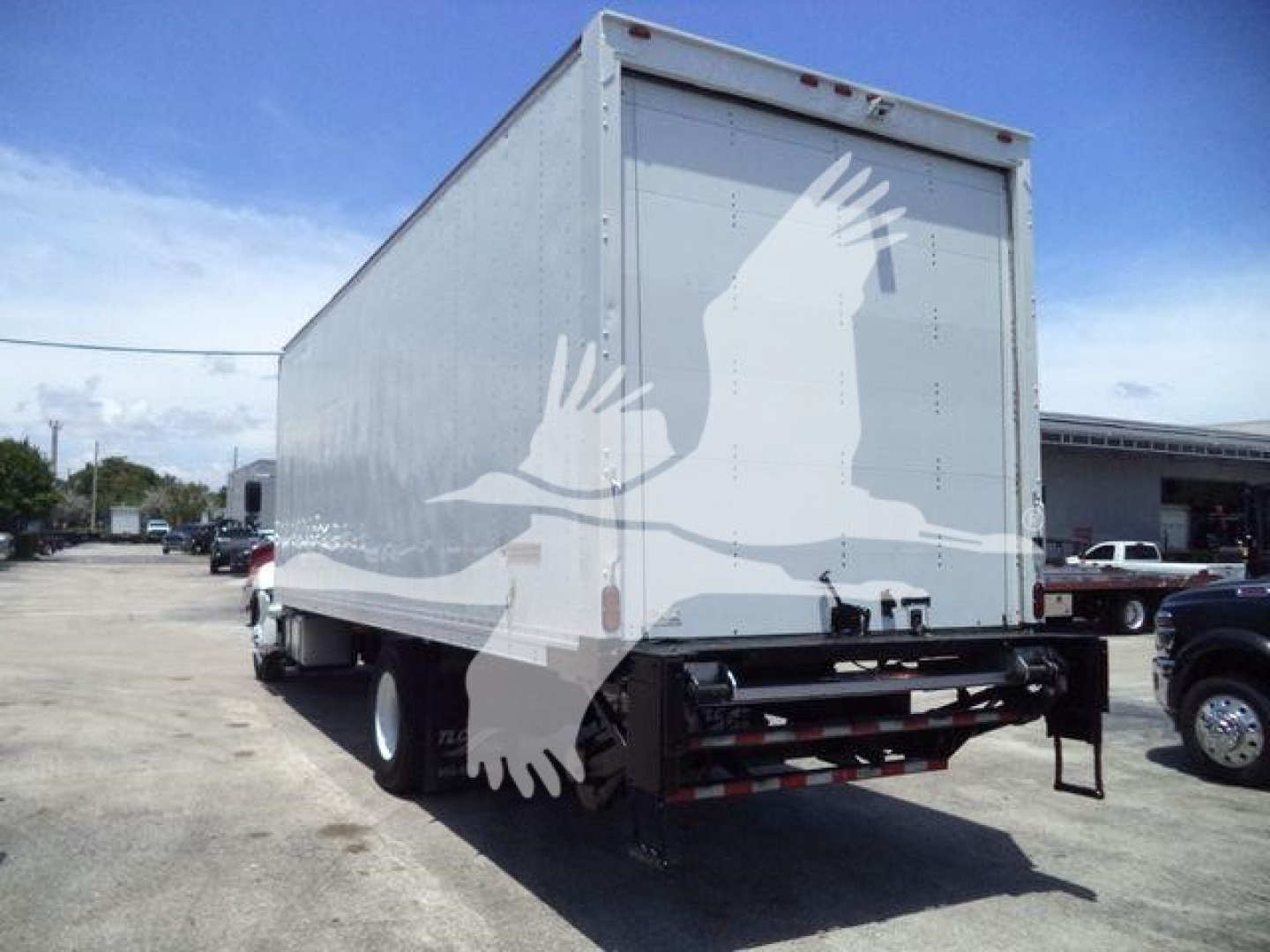 Hino 268A box truck backed view showing cargo box and rear underrun bar