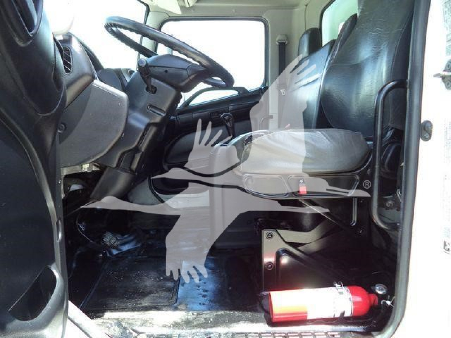 Cab interior of a 2020 Hino 268A used truck showing driver seat, steering wheel, dashboard, and floor area with a fire extinguisher near the door.