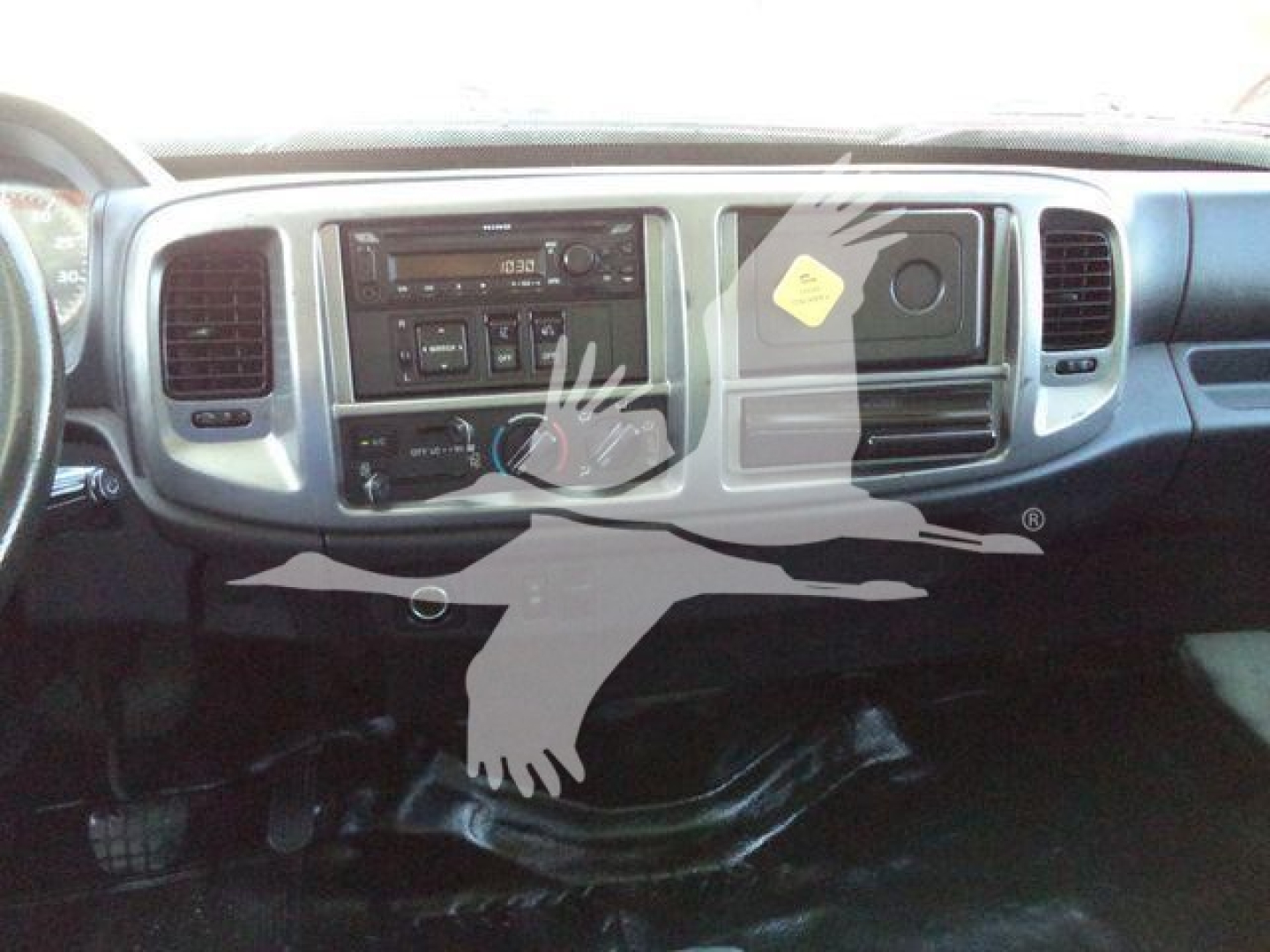 Dashboard of a 2020 Hino 268A box truck showing center console with radio, climate controls, and glove box.
