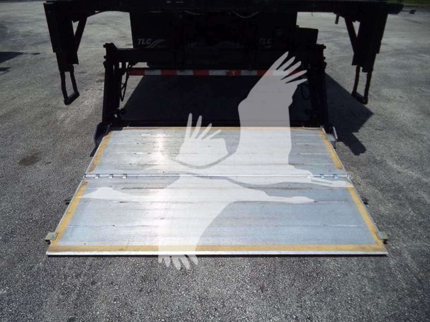 Hino 268A truck rear showing a flatbed ramp/platform.