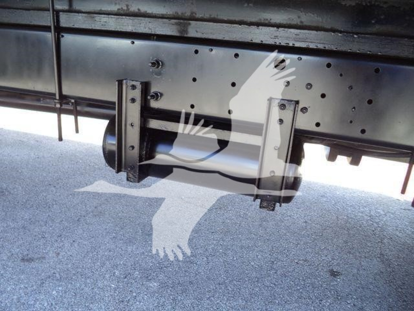 Underbody view of a 2020 Hino 268A box truck showing hitch release and frame components.