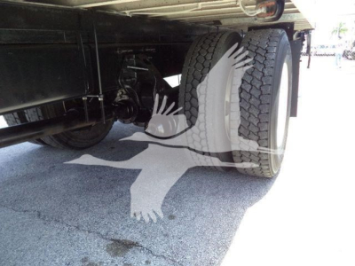 Under the rear of a 2020 Hino 268A truck showing dual rear wheels and undercarriage components.