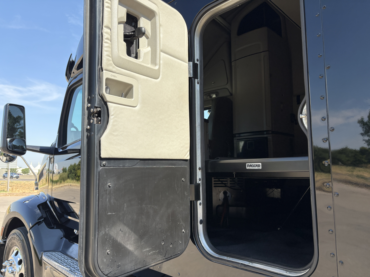Peterbilt 579 cab entry showing door interior and step area with label-free cockpit view.