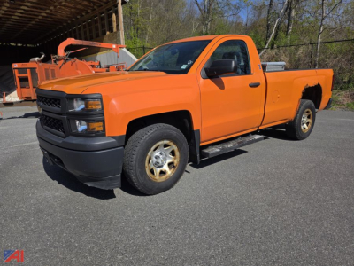 Orange 2015 Chevrolet Silverado 1500 pickup with toolbox in bed, single cab, 4x4, front black bumper and wheels on pavement.