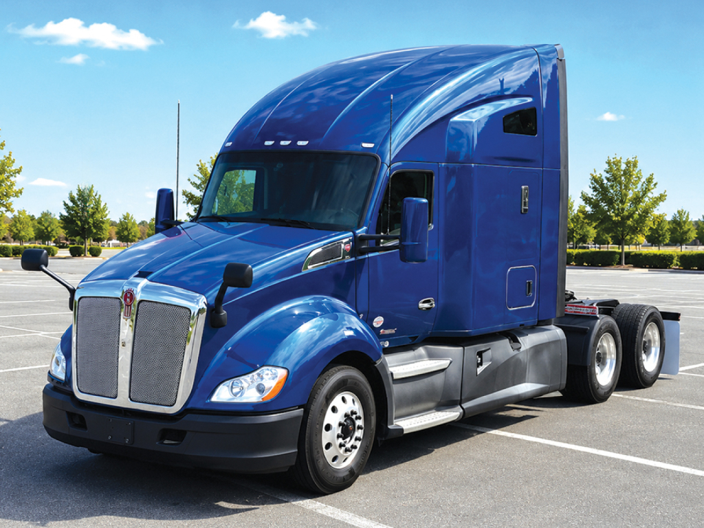 Kenworth T680 semi truck in blue, front-left angle, with sleeper cab and dual rear axles visible.