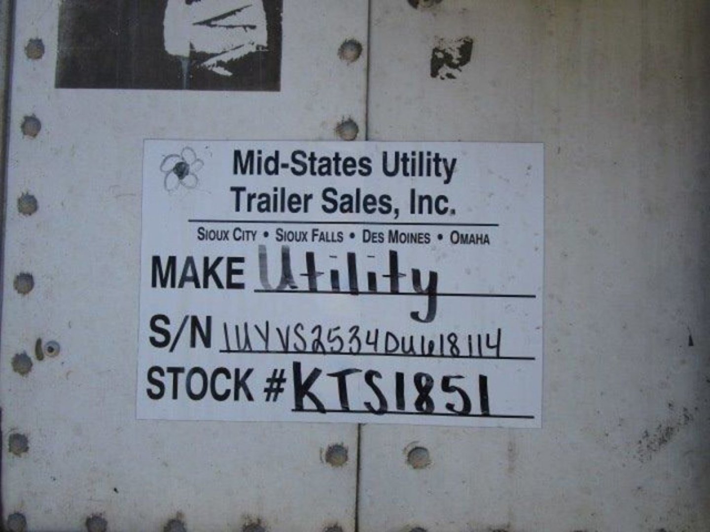 Label on trailer showing Mid-States Utility Trailer Sales Inc. Make Utility, S/N 1UYVS2534DU618114, Stock # KTS1851.