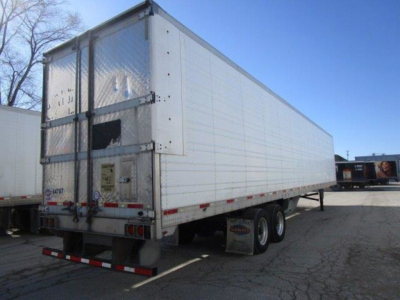Trailer side and rear doors of a refrigerated utility trailer showing metal panels and dual rear doors.
