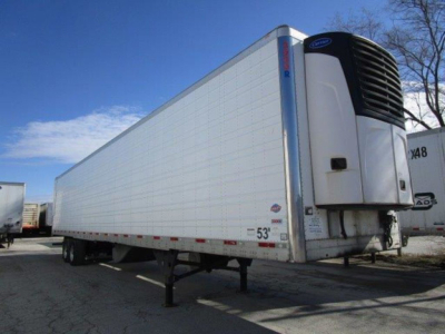 Trailer side view showing a 53' refrigerated trailer with a front-mounted refrigeration unit.