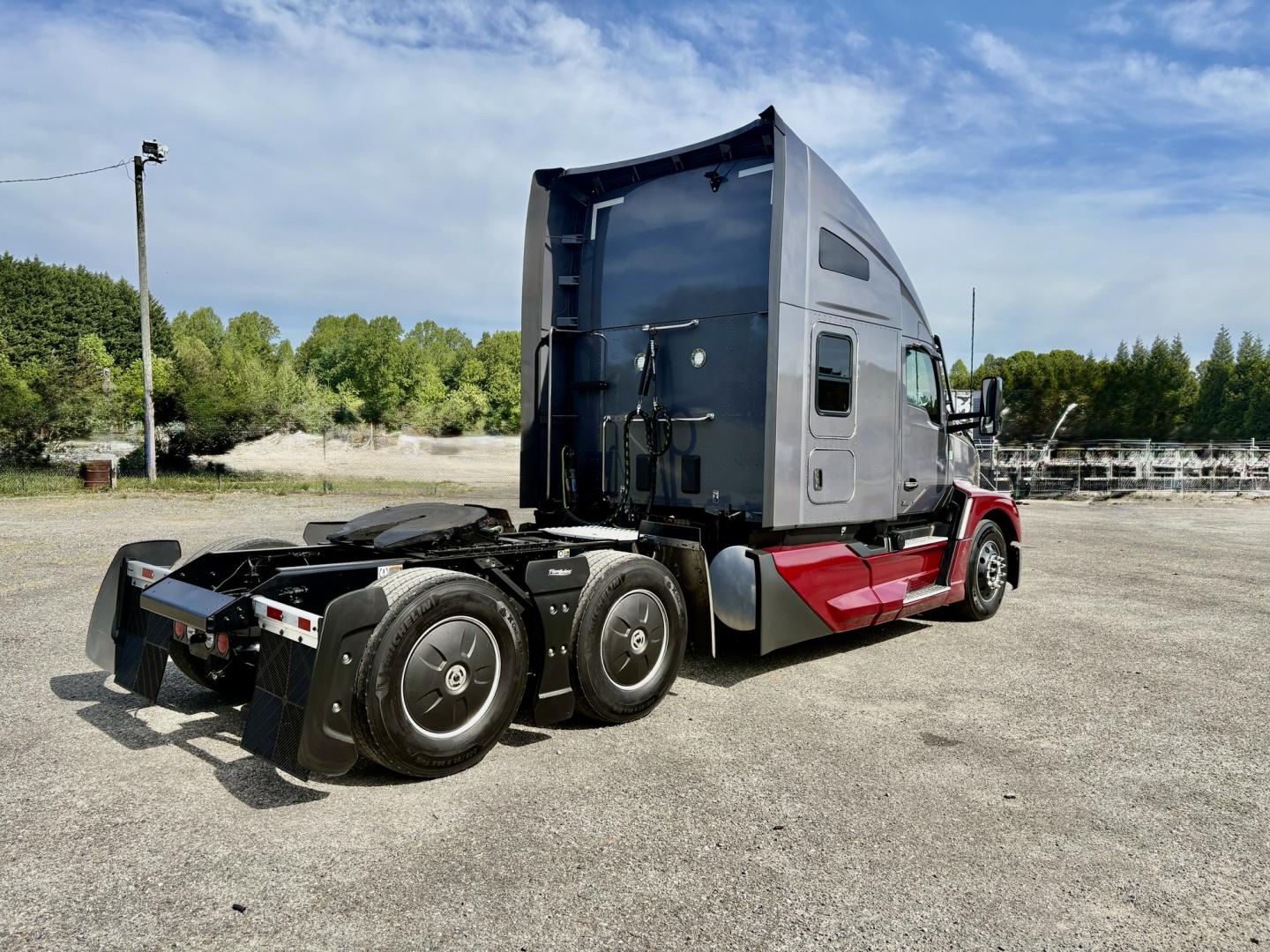 Kenworth T680 tractor truck cab and rear chassis, side view showing sleeper cab and fifth wheel area.