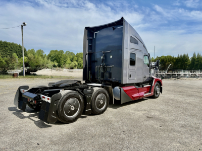 Kenworth T680 tractor truck cab and rear chassis, side view showing sleeper cab and fifth wheel area.