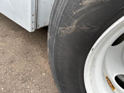 Transcraft combo flatbed trailer wheel and fender with tire and chrome rim visible