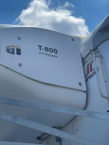 Truck refrigeration unit T-800 Whisper on a trailer side with blue sky