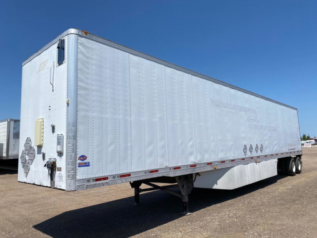 Trailer side view of a 2014 Utility Van with metal riveted panels and dual rear wheels on the right. VIN 1UYVS2531EP829304 and stock U89772 visible.