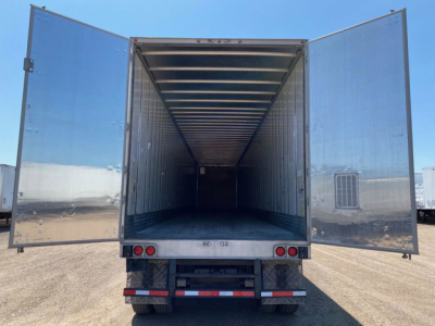 Trailer interior view with rear doors open showing empty cargo space in a 2014 utility van trailer