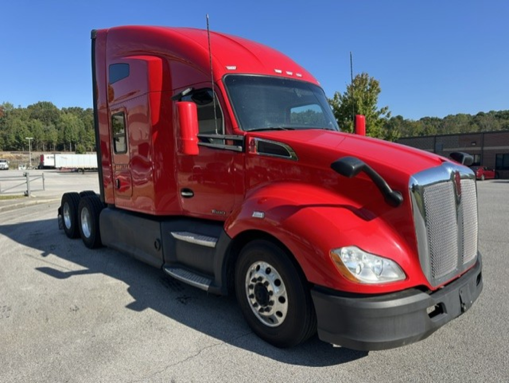 Kenworth T680 conventional sleeper truck in red, front-left view, with chrome grille, aerodynamic mirrors, and dual rear axles.