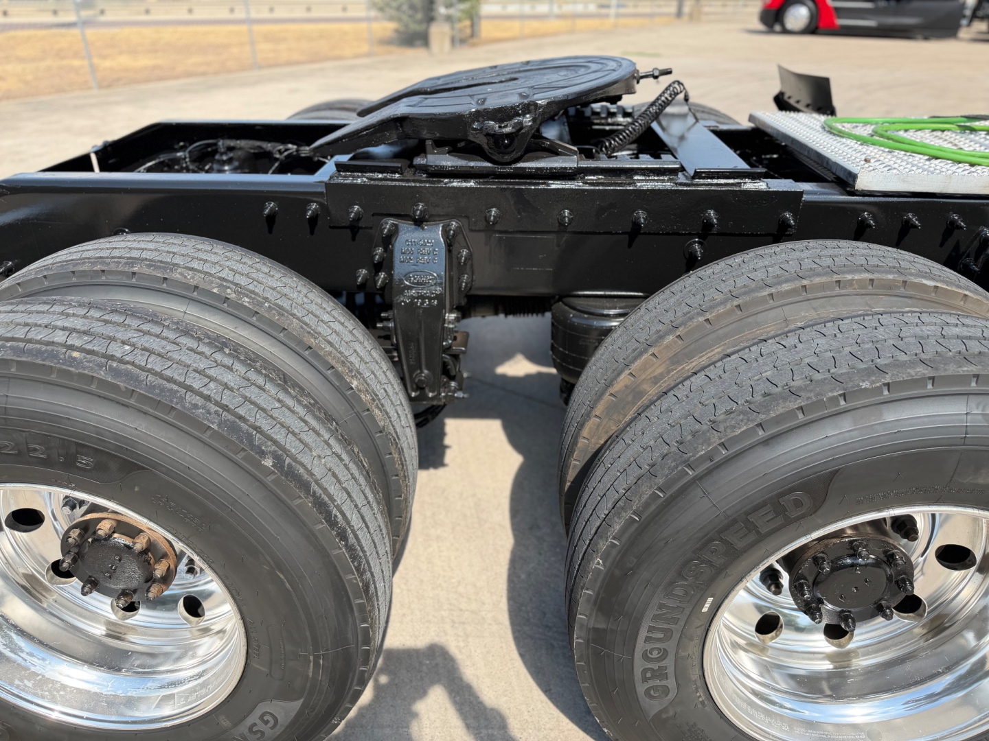 Peterbilt 579 truck chassis with dual rear axles and tires, chassis frame, and fifth wheel visible.