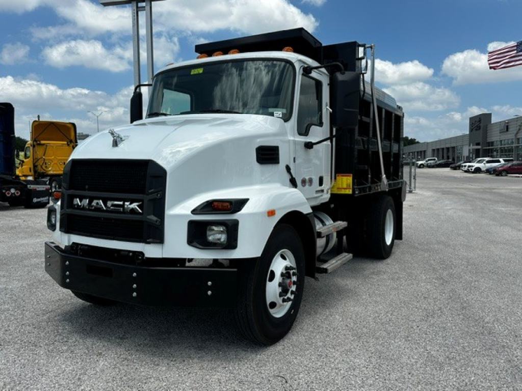 Mack MD7 dump truck in white with front grille and large black bumper, side view showing dump bed, stock number 72356, VIN 1M2MDBAA0VS079041.