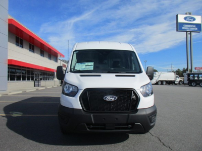 Ford Transit cargo van front view showing large black grille and Ford emblem.
