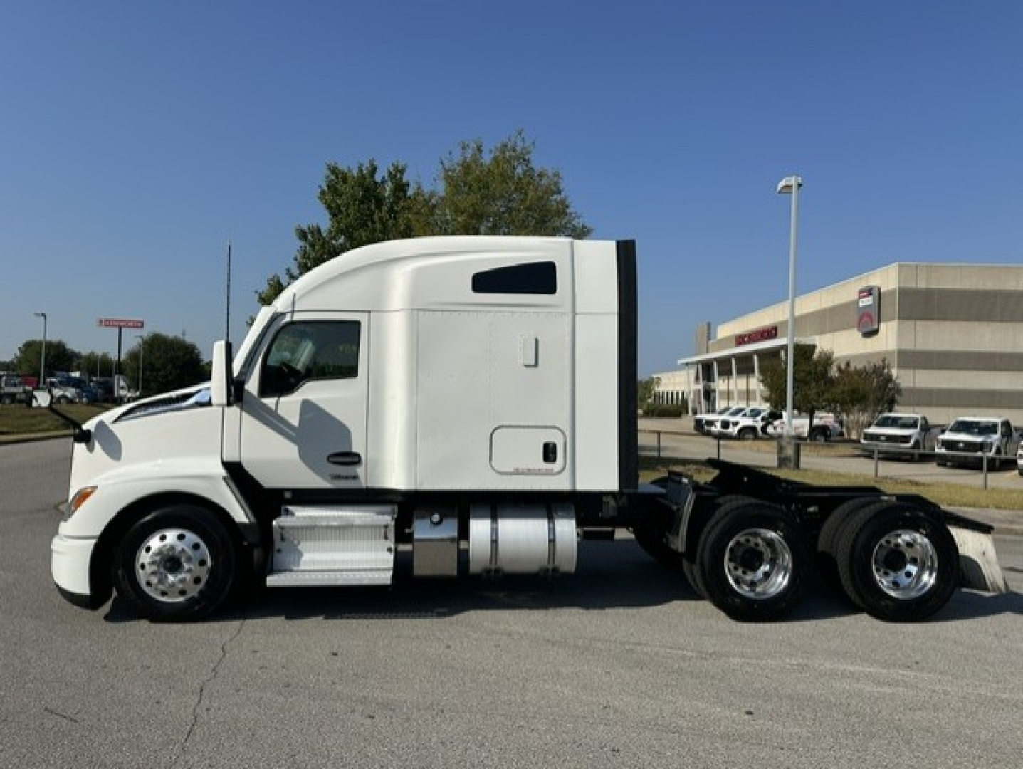 Kenworth T680 conventional sleeper truck side view showing cab and chassis with dual rear axles.