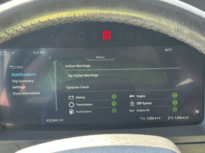 Kenworth T680 dashboard display showing system checks and warnings with green check marks; active warnings: No Active Warnings; battery, engine, transmission, DEF system, fuel system, engine oil all indicated with green checks; trip data 1,