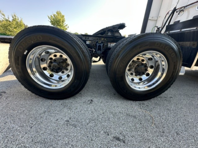 Kenworth T680 truck chassis with Dual rear wheels and chrome rims showing wheel hubs and tires