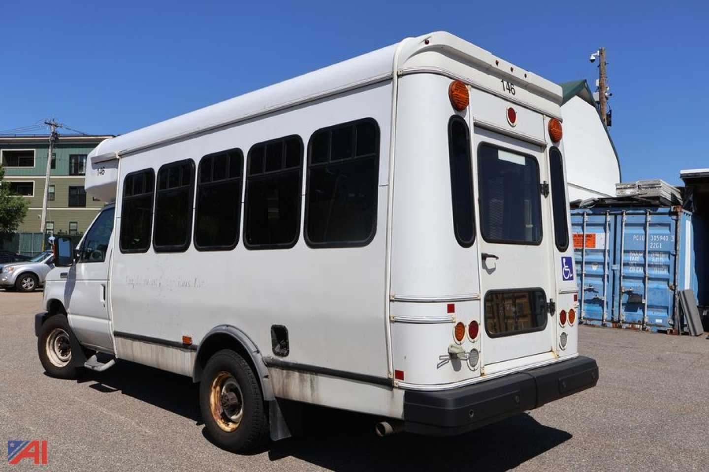 Ford e350 wheelchair bus rear-left view showing windows and rear bumper