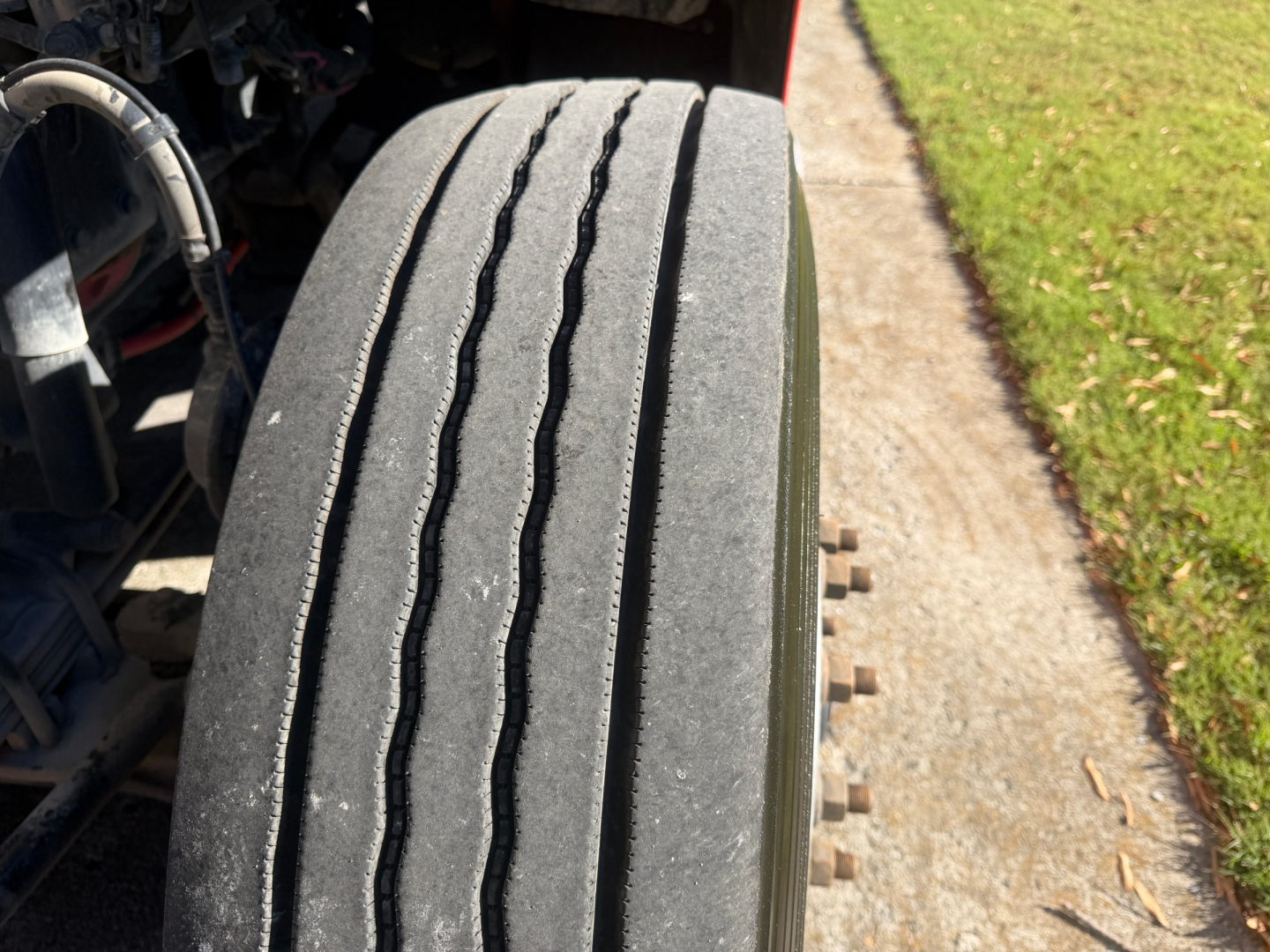 Peterbilt 579 front tire tread close-up in a truck cab area, with VIN and stock number not visible in image.