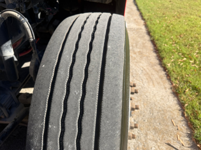 Peterbilt 579 front tire tread close-up in a truck cab area, with VIN and stock number not visible in image.