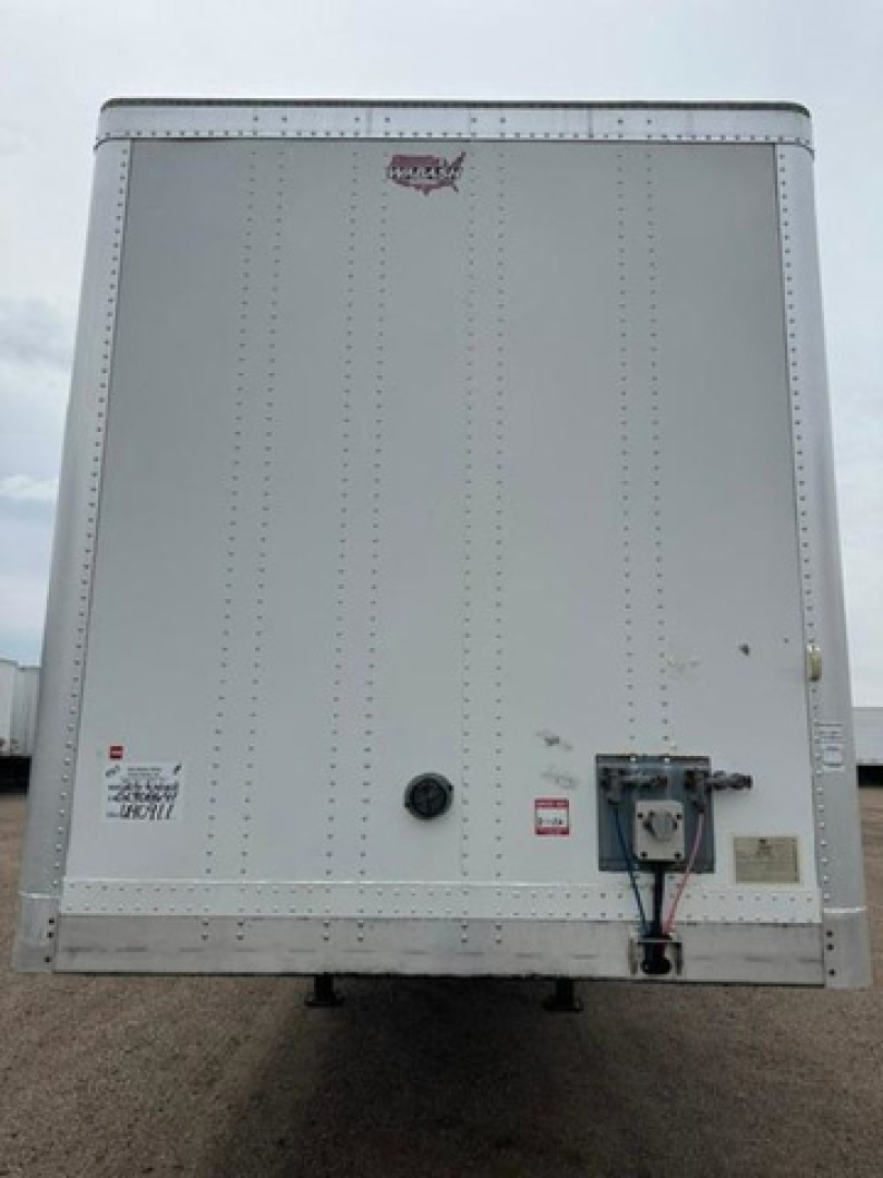 Rear view of a white 2016 Wabash van trailer with riveted aluminum sides, access/lock box and trailer hitch area visible.