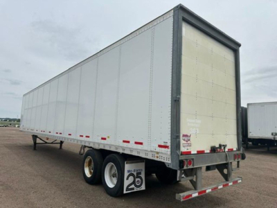 Trailer rear and side view of a 2016 Wabash van trailer showing dual rear doors, wheel fenders, and reflective tape.