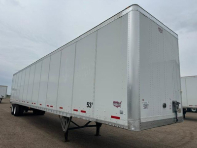 Wabash van trailer side and front corner showing 53' length, aluminum side panels, rear undercarriage, and hitch area.
