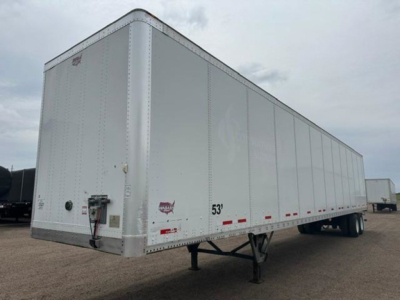 Trailer side view showing a 53' white Wabash van trailer with front access point, landing gear, and rear wheels visible.