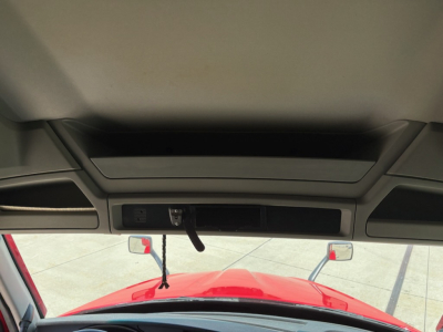 Kenworth T680 cab interior front view showing windshield and rearview mirrors; no detailed labels visible.