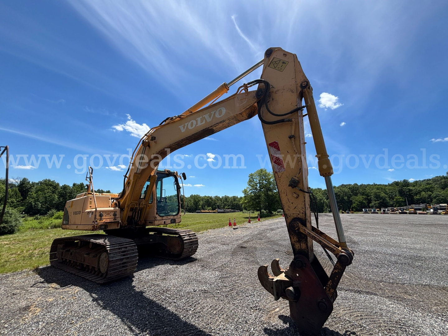 Volvo EC160B excavator in-service showing hydraulic arm and bucket with Volvo branding on the boom.