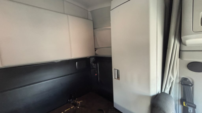 Kenworth T680 cabin interior showing sleeper area and partition door