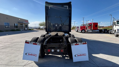Kenworth T680 rear view showing fifth wheel and dual rear axles with MHC mud flaps.