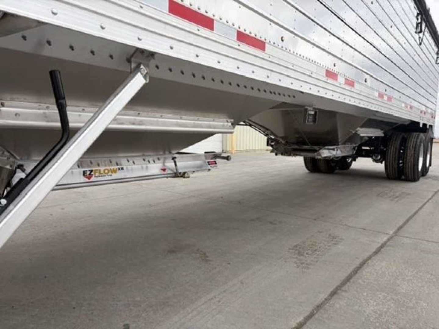 Trailer underside showing side access stairs and EZ Flow component under a 2026 Timpte Super Hopper trailer.