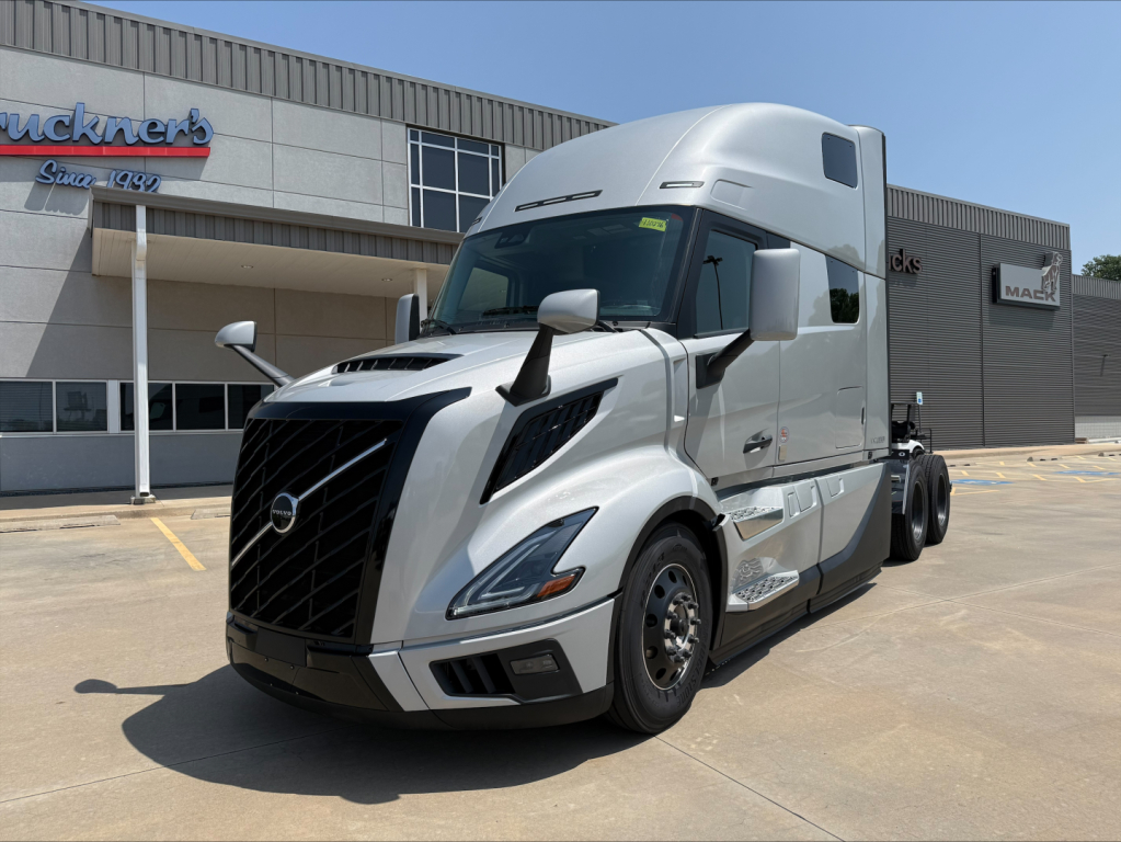 Volvo VNL64T860 tractor-trailer front-left view showing aerodynamic cab and grille