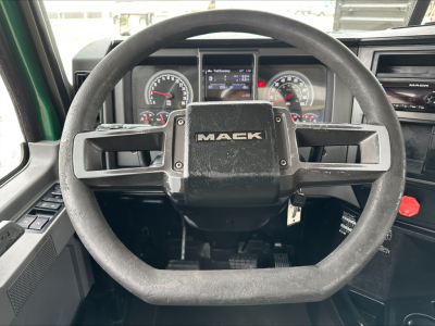 Mack PI64T steering wheel and dashboard view with instrument cluster and center display.