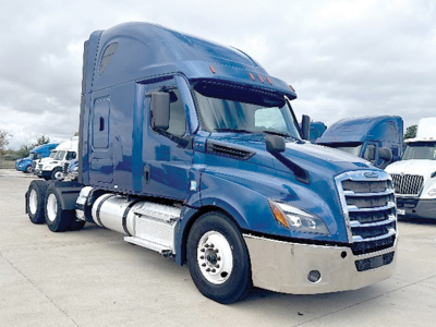 Freightliner Cascadia126 sleeper cab tractor showing front grille and side view with blue paint and chrome bumper.