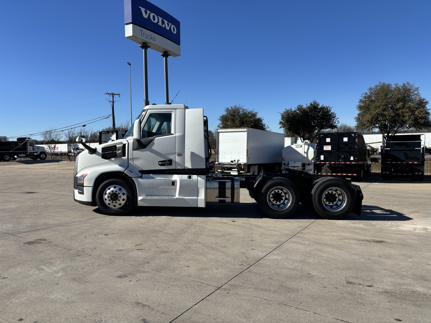 2027 Mack PR64T conventional daycab tractor side view showing extended chassis and dual rear axles.
