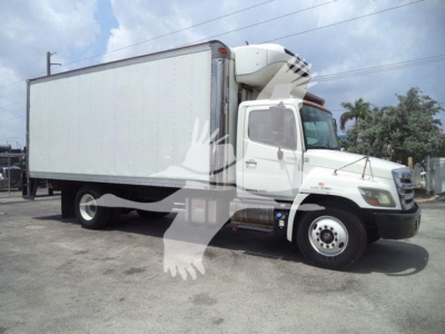 2015 Hino 268A refrigerated truck side view with cargo box and refrigeration unit on cab; VIN tag not visible.