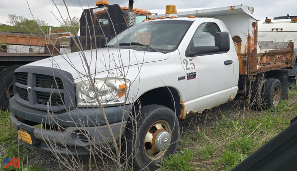 Dodge Ram 3500 heavy duty dump truck side view showing rusted dump bed and utility equip in-service vehicle