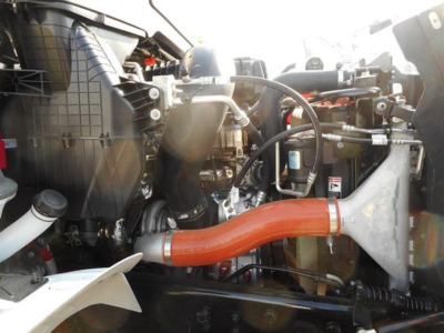 Western Star 47X engine bay showing orange intercooler pipe and intake components.