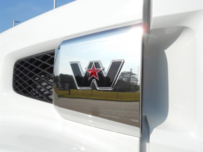 Front grille and emblem of a Western Star truck with chrome star logo.