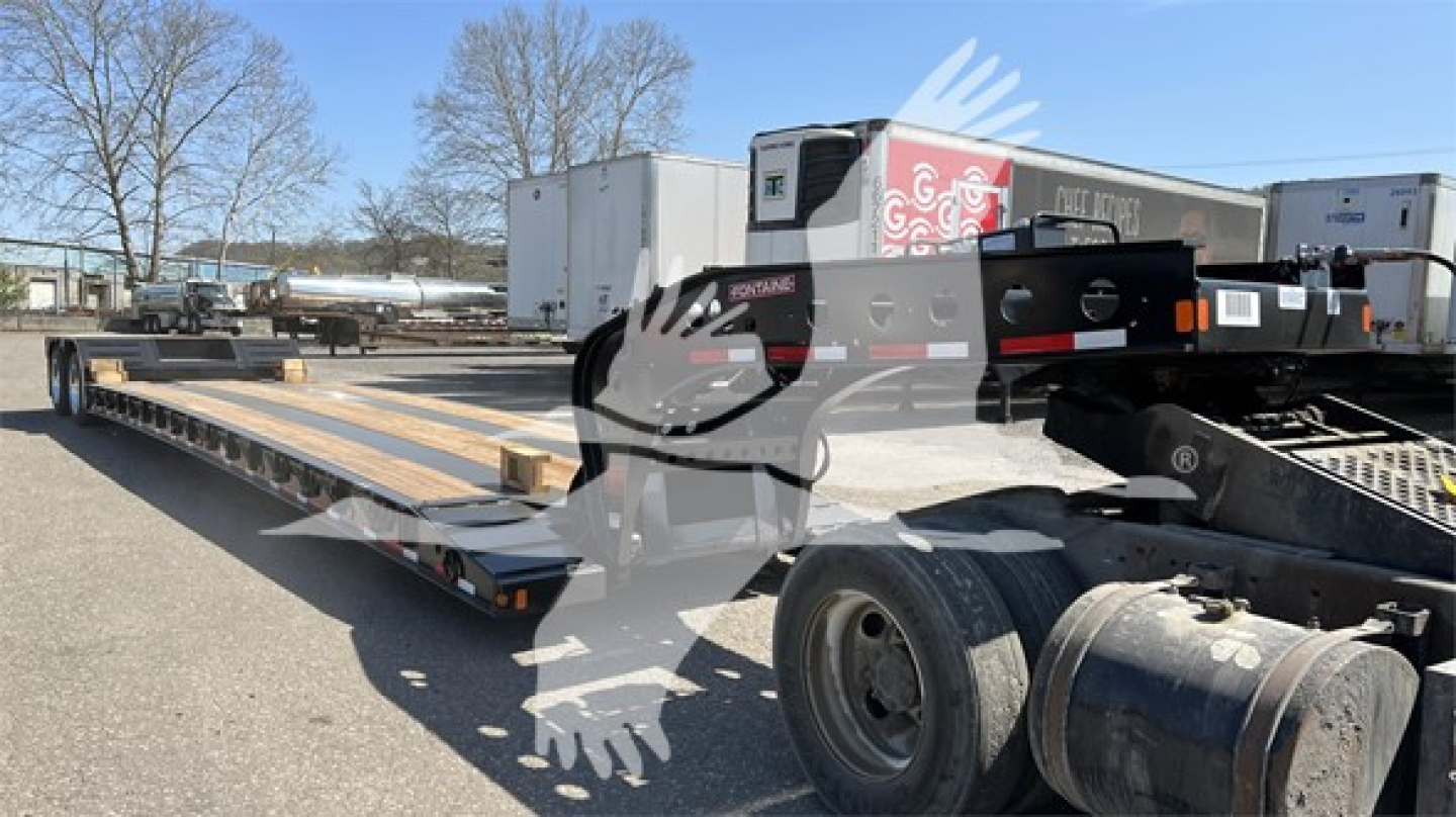 Fontaine Renegade Xn20 lowboy trailer showing long steel deck, ramps, and wheel area.