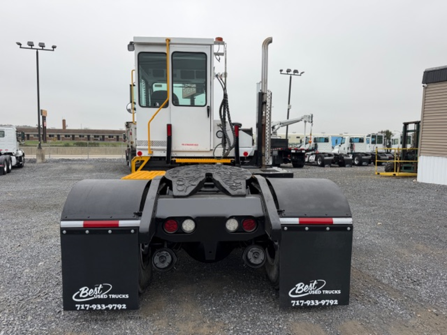 Capacity TJ5000 vehicle rear view showing mud flaps with Best Used Trucks logo and dual rear wheels.