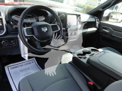 Ram 4500 SLT interior showing steering wheel with Ram emblem, center console, dashboard, and infotainment screen.