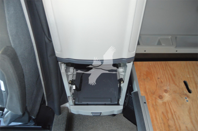Peterbilt 579 cab interior showing under-cab storage area with access panel and floorboard in view.