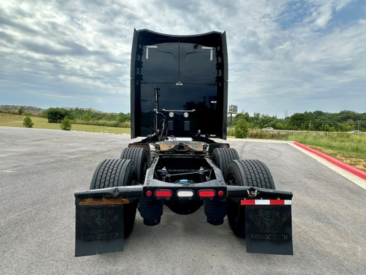 Peterbilt 579 truck rear view showing chassis and mud flaps, no sensors visible.